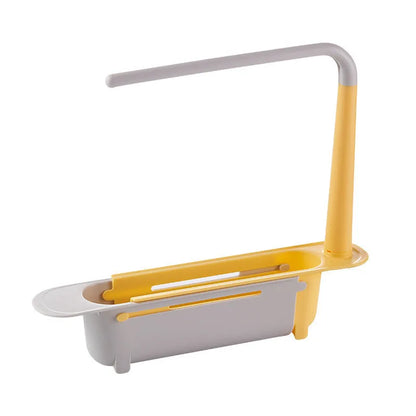 Telescopic plastic kitchen sink drain rack with multi-coloured modular baskets.