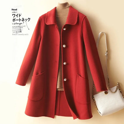 Women's double-faced wool mid-length coat with a doll collar and pearl buckle detail in a solid colour.