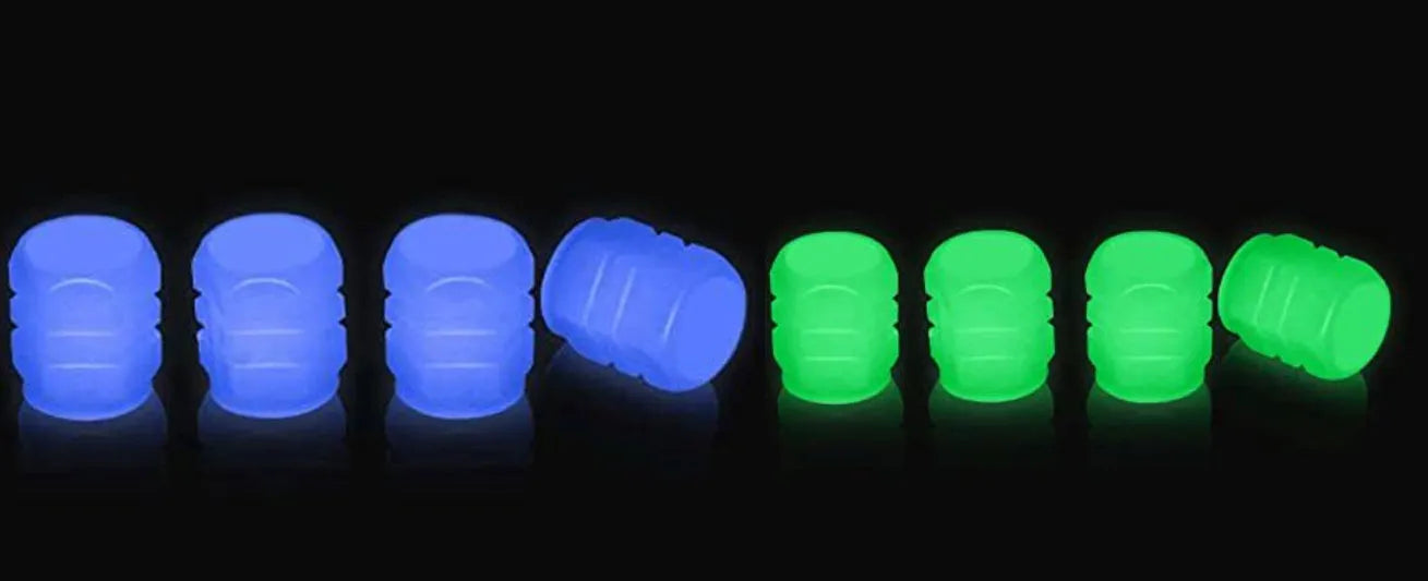 Glow-in-the-dark rubber tyre valve caps in five colour options on tyre valve stem