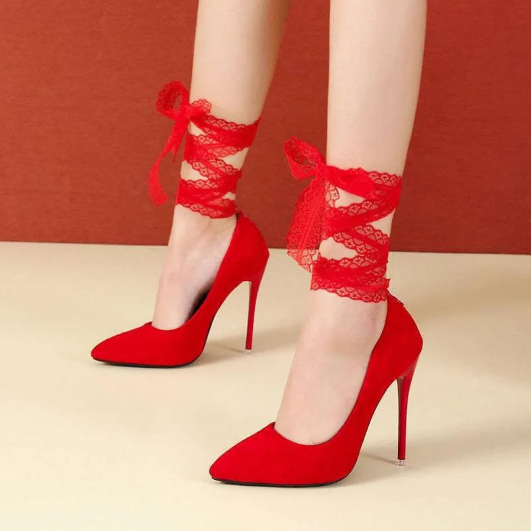 Women's black thin shallow mouth strap high heels with pointed toe on a white background