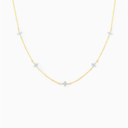 Elegant gold and silver floral necklace with adjustable chain and flower charm, perfect for vacation and beach outfits