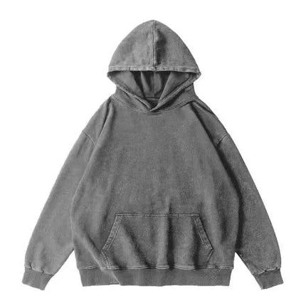 Man wearing a loose, collarless cotton hoodie with a batik-washed texture in a brown colour.