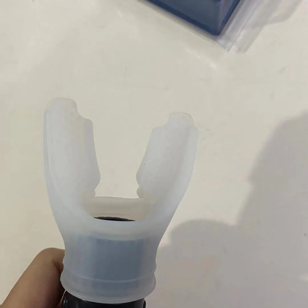 White and black adjustable resistance breathing trainer with silicone mouthpiece