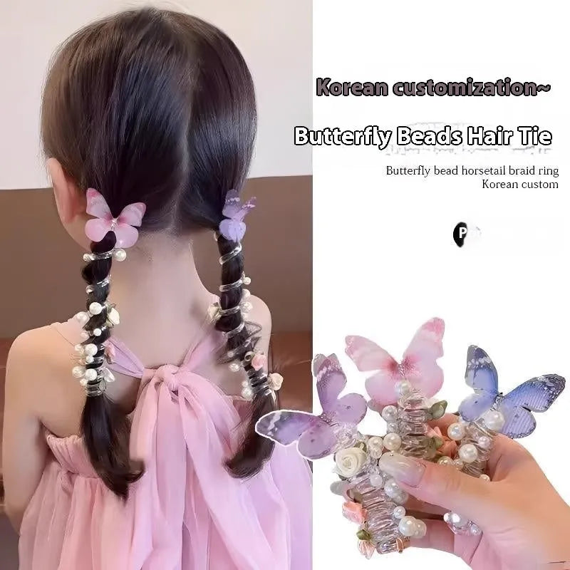 Colourful butterfly and pearl elastic hair band for children on a white background.