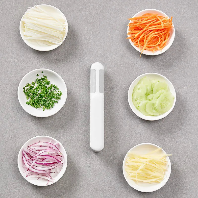 White multifunctional rotary kitchen peeler with stainless steel blade and ergonomic PP handle.