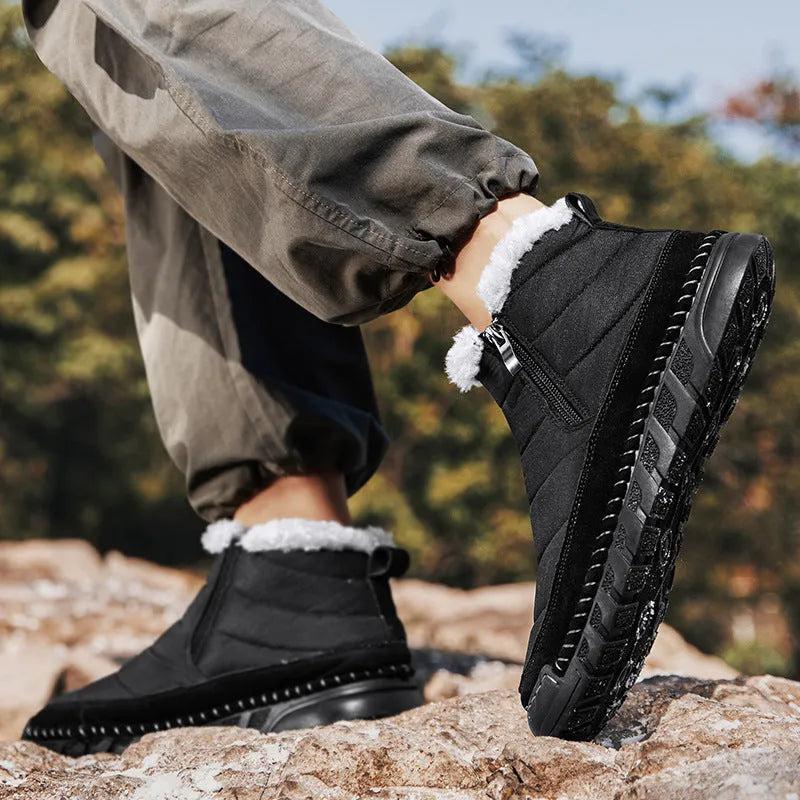 Men's plus size snow boot in black with round toe, flat heel, and rubber sole.