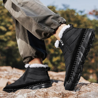 Men's plus size snow boot in black with round toe, flat heel, and rubber sole.