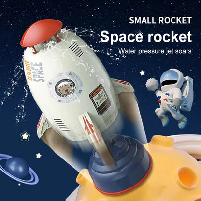 Yellow outdoor water pressure rocket launcher toy for kids on a green lawn.