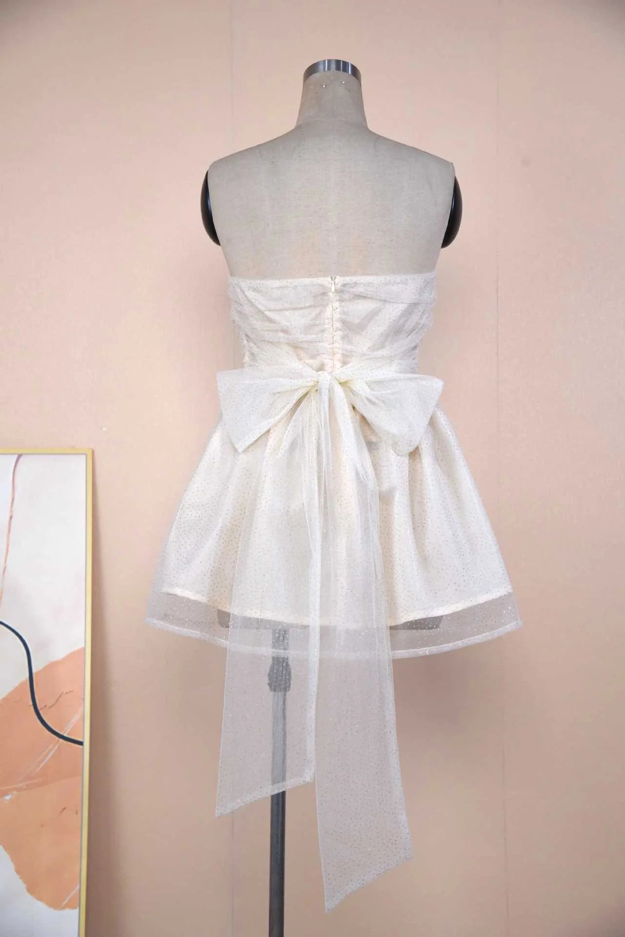 Elegant lace cocktail dress with graceful bow detail, available in various colours and sizes