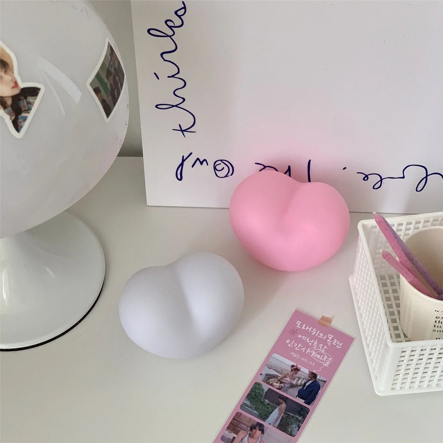 White and pink vinyl atmosphere lamps in trumpet and tuba shapes showing 8cm and 11cm size options
