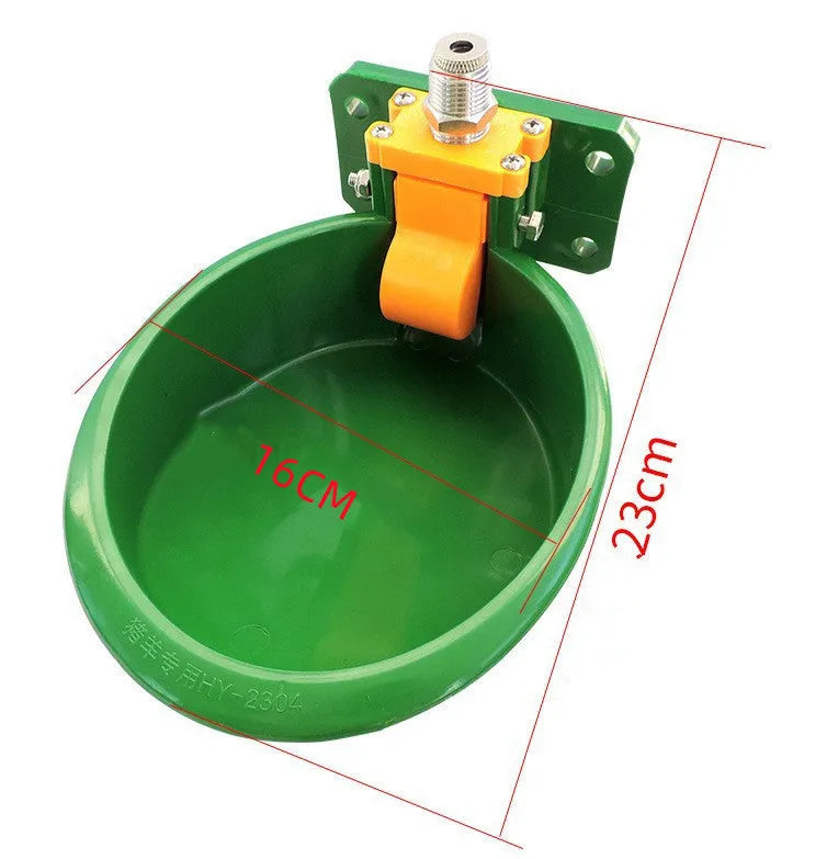 Green plastic automatic water drinking bowl for sheep and pigs on farm