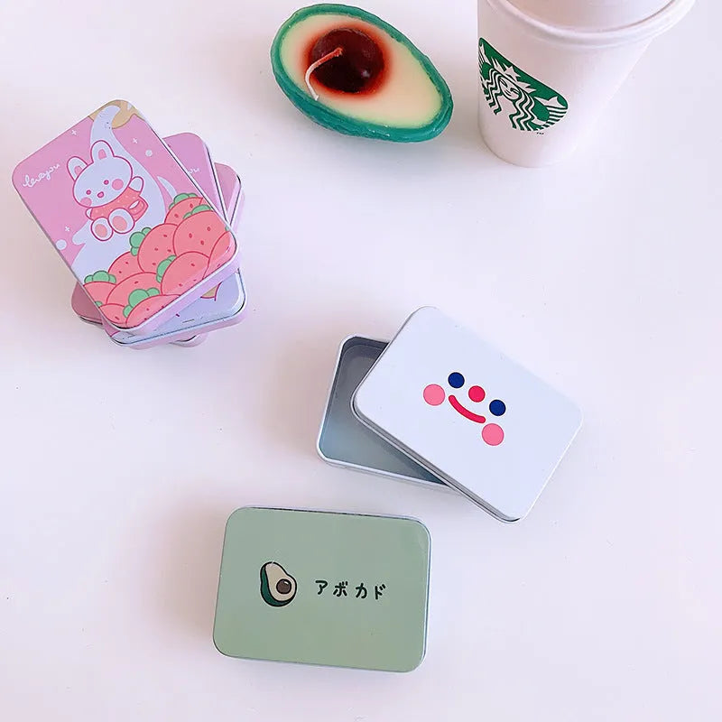 Small white iron storage box with a printed apple girl design on the lid.