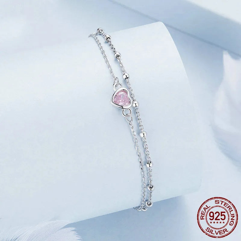 Sweet girlish sterling silver bracelet with a small heart charm on an adjustable chain.