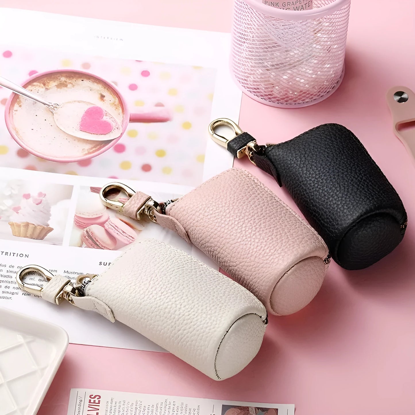 Minimalist black PU leather key wallet with a silver metal zipper closure.