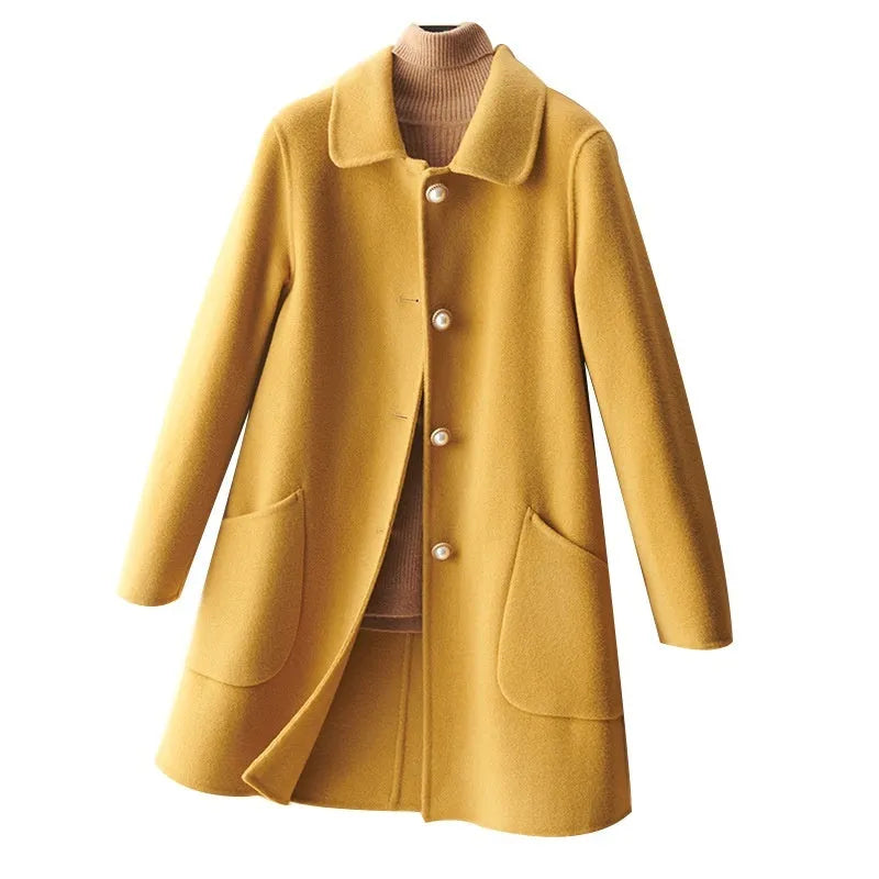 Women's double-faced wool mid-length coat with a doll collar and pearl buckle detail in a solid colour.