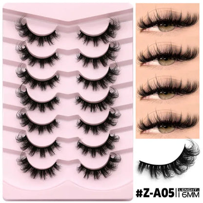 Box containing six pairs of black artificial fibre false eyelashes with different styles and a tube of clear lash glue.