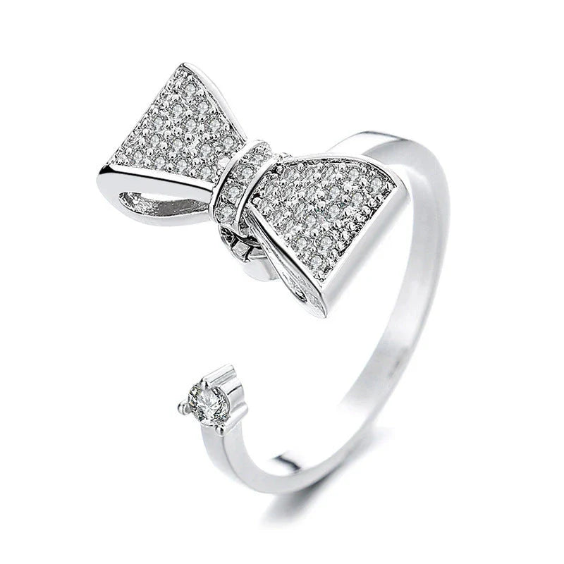 Adjustable spinner ring with rotating floral, geometric, and nature-inspired motifs for women's fashion and stress relief