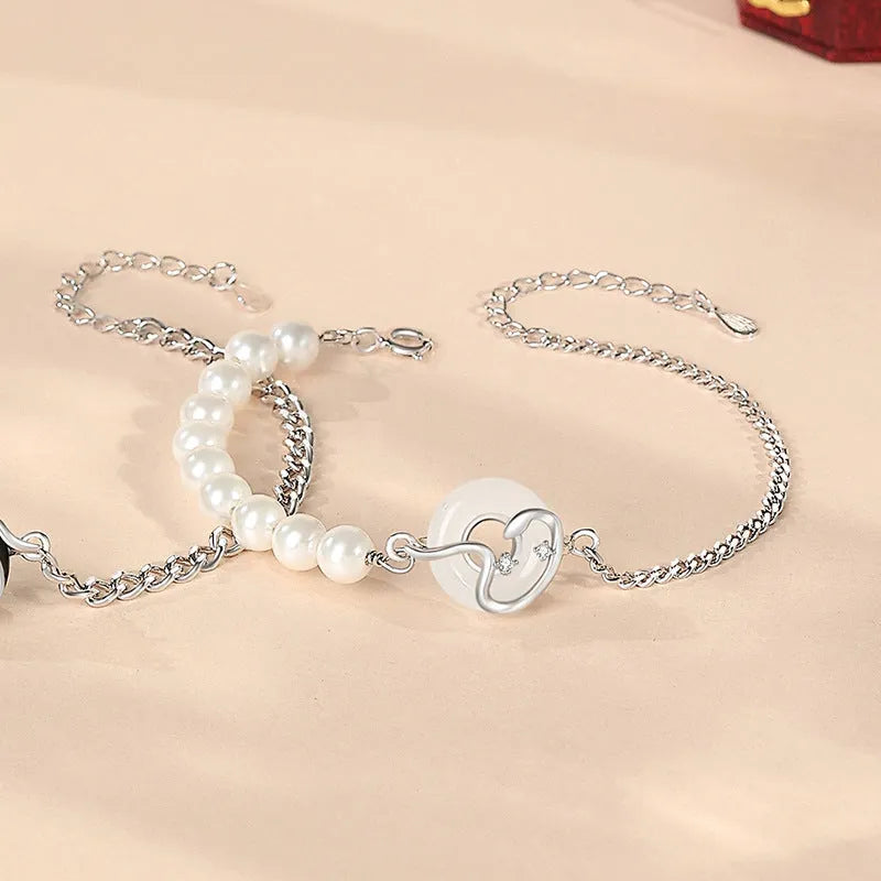 A New Chinese style 925 sterling silver couple's bracelet with snake zodiac detailing and a safe buckle clasp.