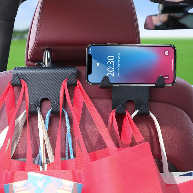 Black ABS plastic car hook and mobile phone holder bracket for rear seat mounting.