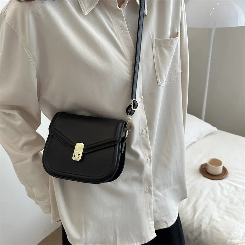Shoulder messenger bag in soft PU leather with textured finish, horizontal rectangular shape for daily essentials, available in white, black, dark brown, and khaki colour options