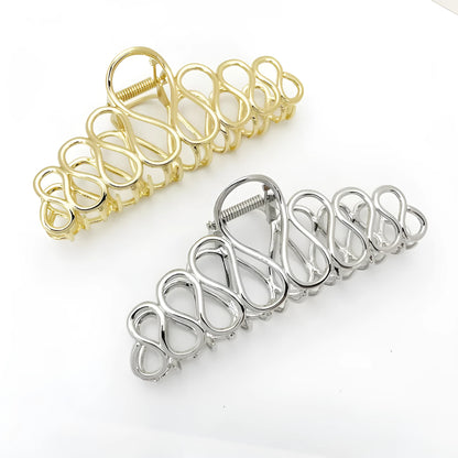 Large minimalist alloy hair clip with electroplated gold finish and irregular tassel decoration for creating updo hairstyles