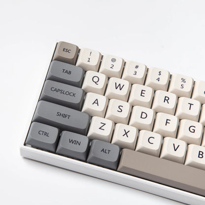Complete set of 139 PBT XDA profile keycaps for mechanical keyboards with English legends laid out on a table.