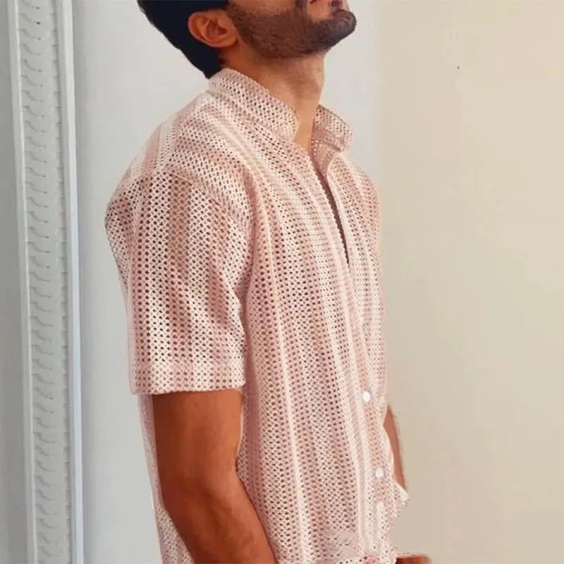 Pink men's short-sleeve waffle-knit shirt with a loose cardigan style on a hanger.