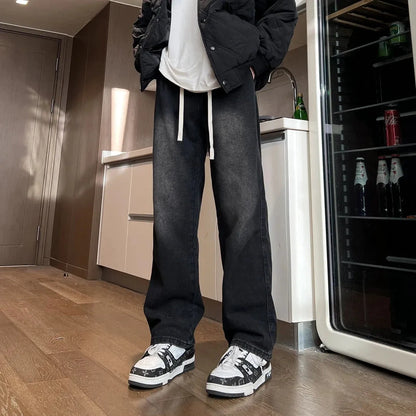 Men's blue straight-leg denim trousers with drawstring waist shown on hanger