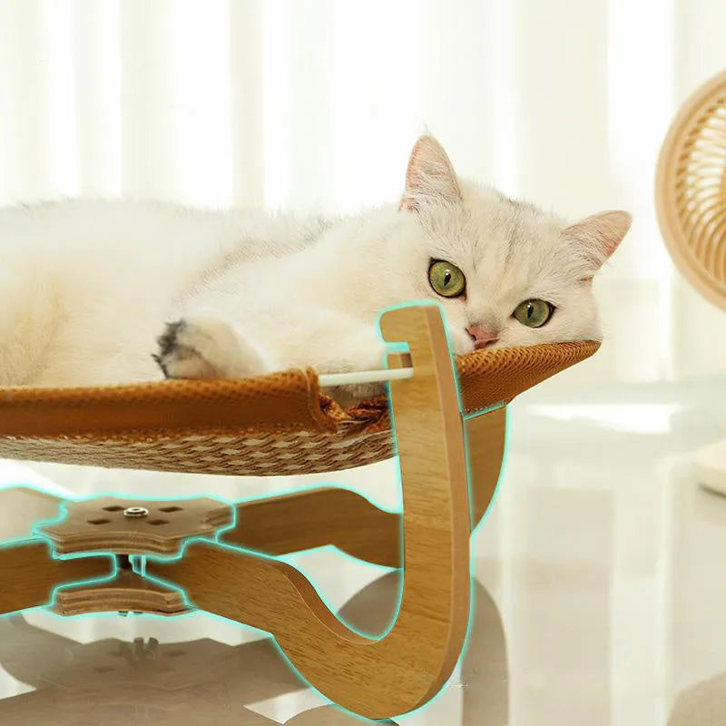Brown woven rattan pet hammock bed for cats and small dogs on a flat surface.