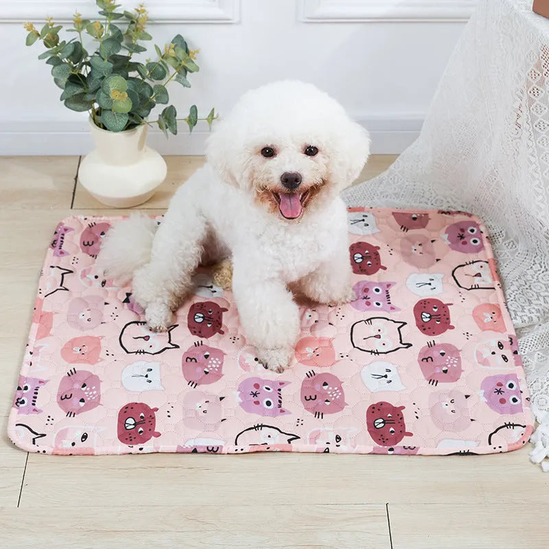 Reusable washable pet urine pad showing colourful animal pattern and waterproof backing.