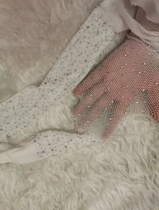 A pair of women's sheer black fishnet ankle socks with a diamond mesh pattern and soft acrylic cuff, laid flat.