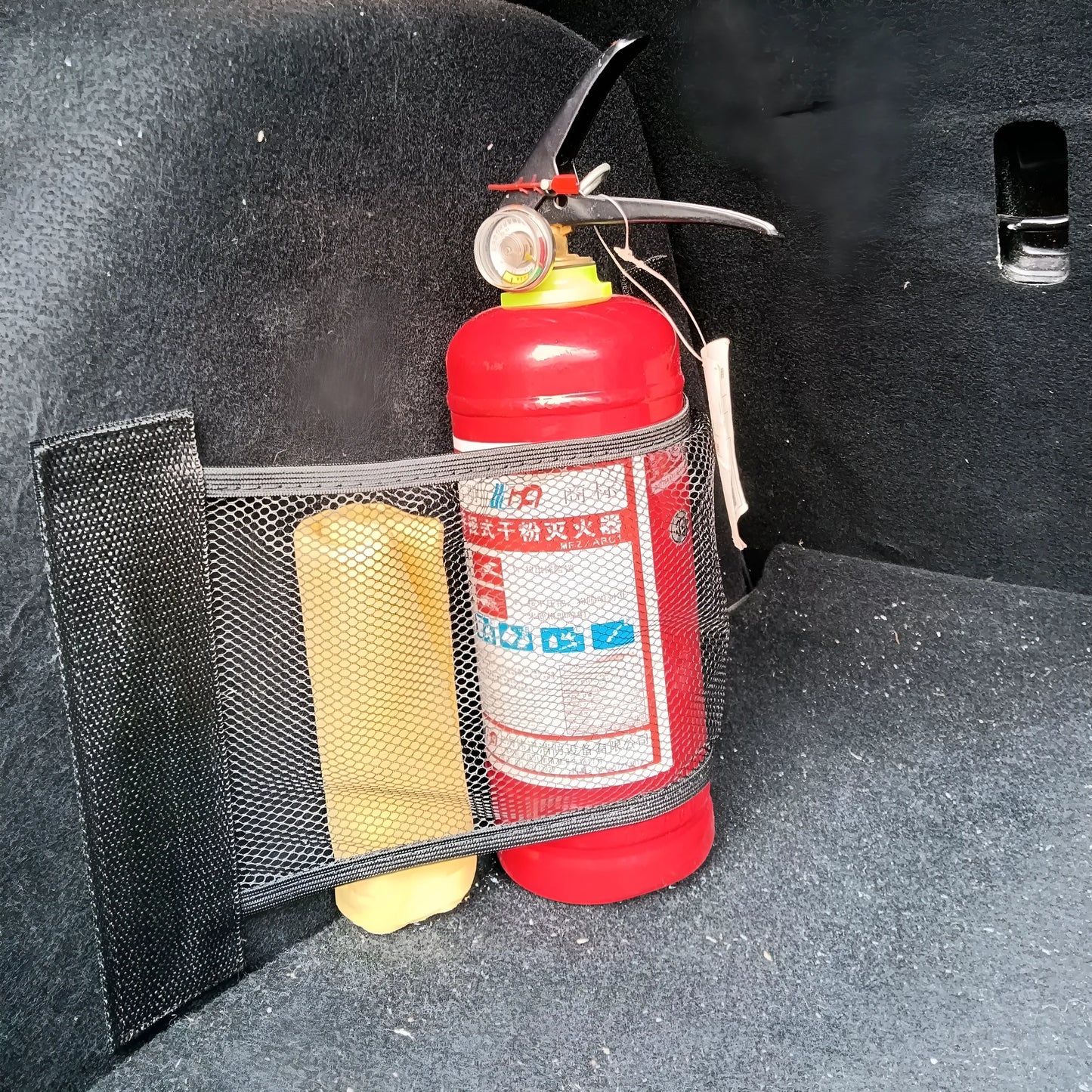Elastic car boot storage net in polyester material for organising loose items in luggage compartment