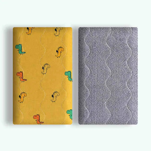 Double-sided cotton wool pet blanket in dinosaur print showing reversible construction