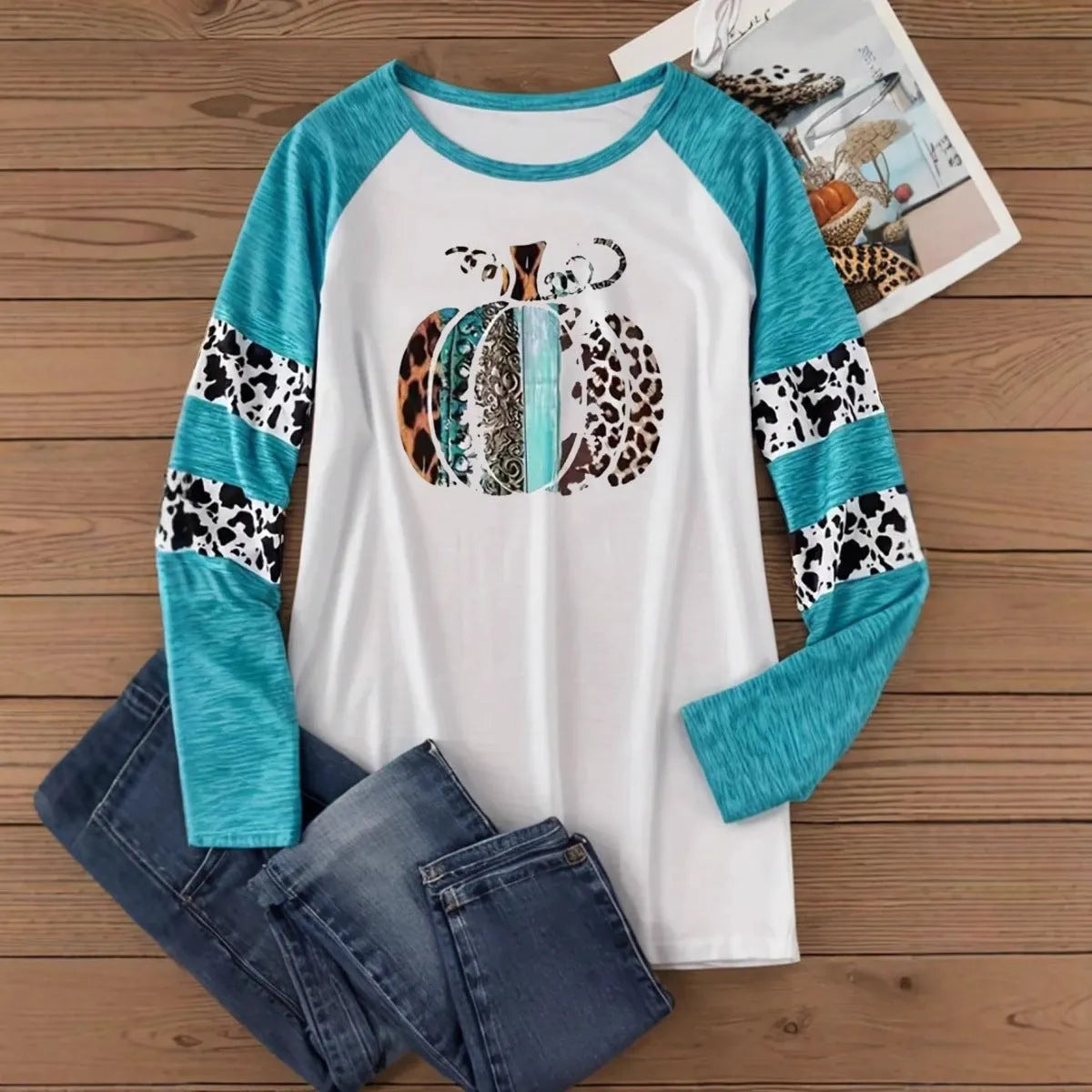 Sky blue long sleeve t-shirt with a large 3D printed Halloween pumpkin design on the front.