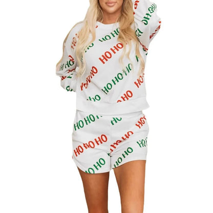 White women's two-piece suit with printed letters design, long sleeves, and matching trousers