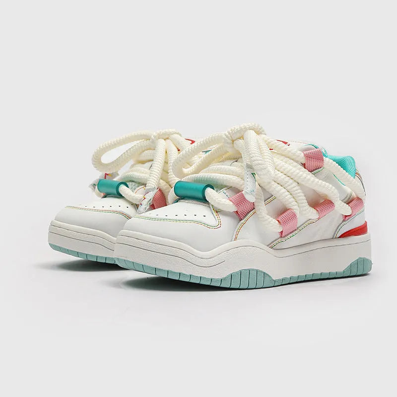 Low-top unisex casual shoes in denim blue with a round toe, thick rubber sole, and front lace-up closure.