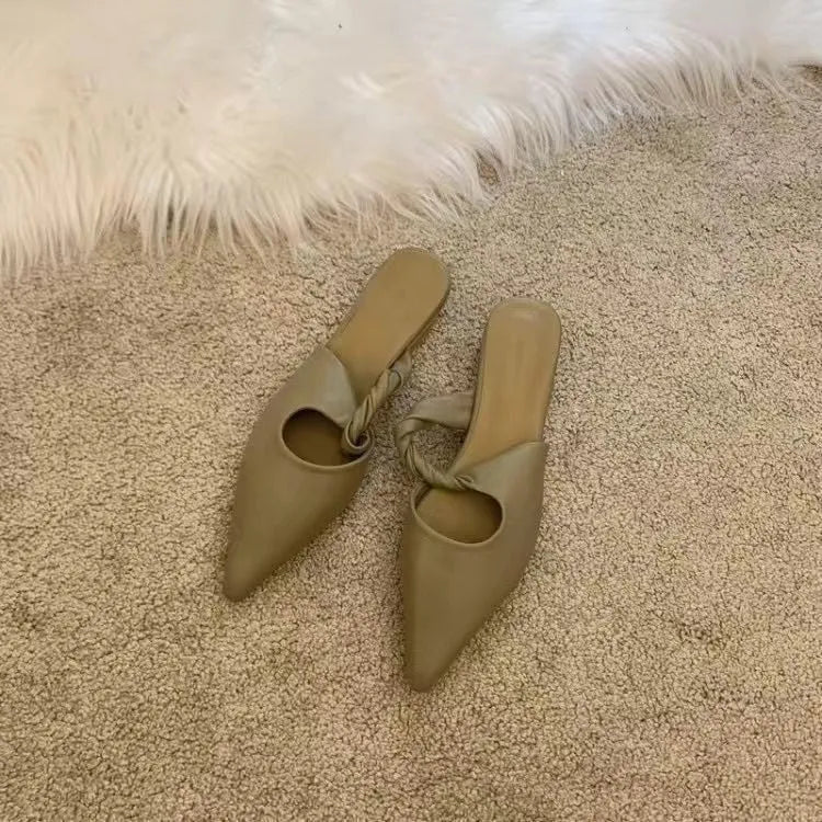 Women's soft leather-lined semi-toe box slippers in neutral colours on a rubber sole.
