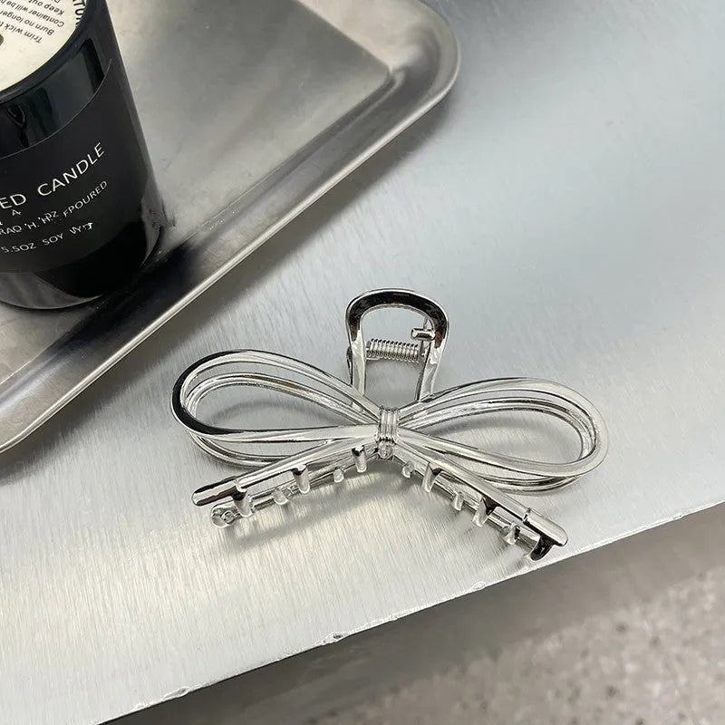 Alloy bow barrette hair grip in silver or gold colour for women's back-of-head styling