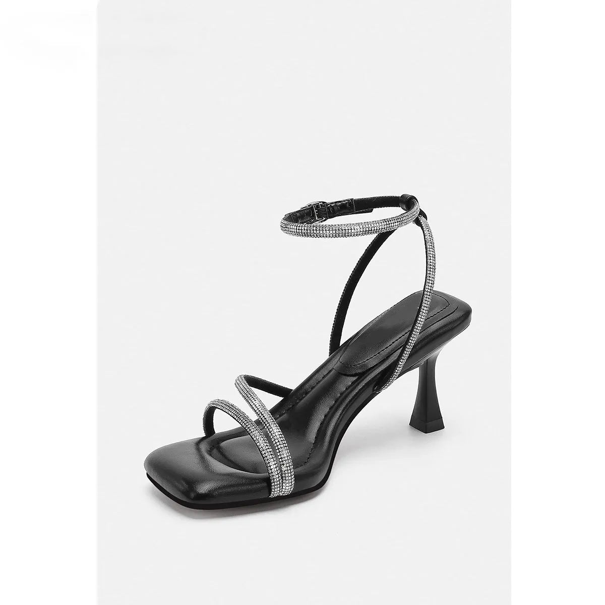 Women's silver rhinestone sandals with square toe and ankle strap buckle on a white background.