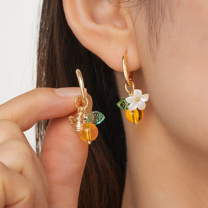 Adjustable women's ear cuffs with bee-shaped pendant, glass leaves, and floral elements in XY-123 colour