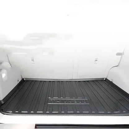 Black carbon fibre pattern tailored car boot liner mat fitted in an estate vehicle