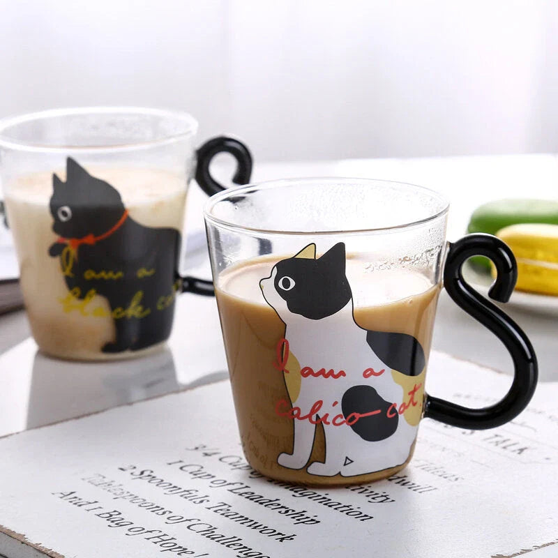 Adorable cat-themed glass mug with a whimsical cat-shaped handle, perfect for coffee, tea, and juice lovers