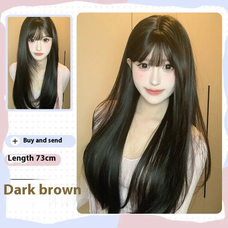 Dark brown long straight synthetic wig with fringe on a wig stand.