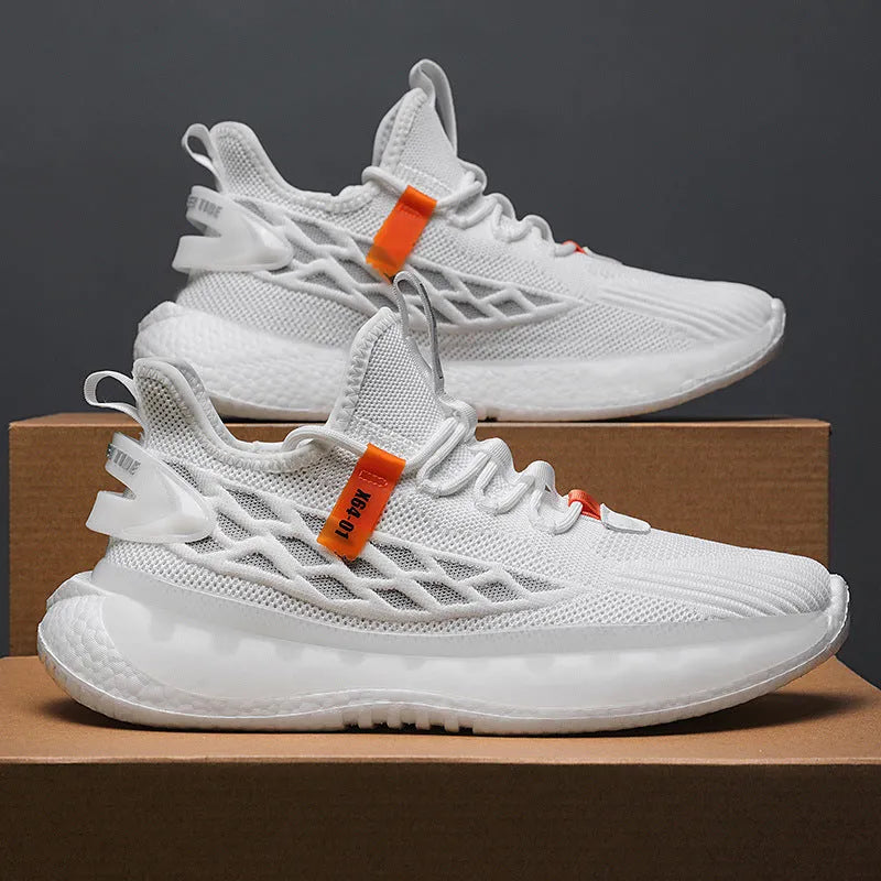 Men's white low-top sneakers with mesh upper and flat rubber sole on a grey background.