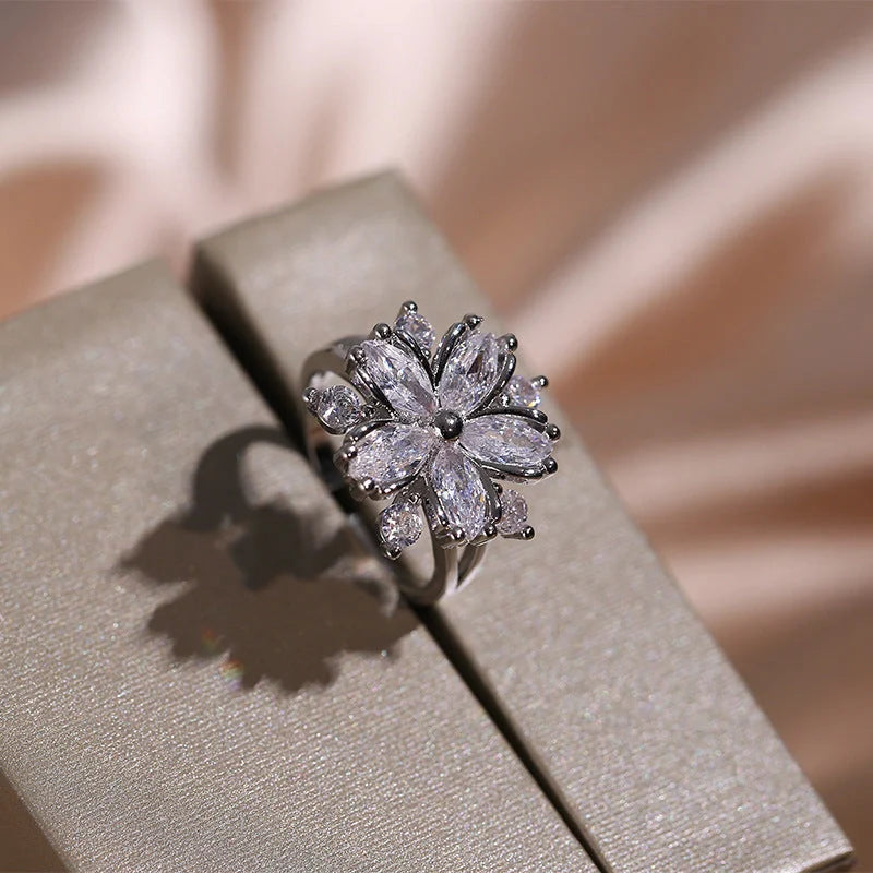 Dazzling cubic zirconia jewellery set with double-layered flower design, including ring, necklace, and earrings in pink and white diamond colours