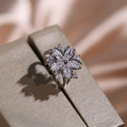 Dazzling cubic zirconia jewellery set with double-layered flower design, including ring, necklace, and earrings in pink and white diamond colours
