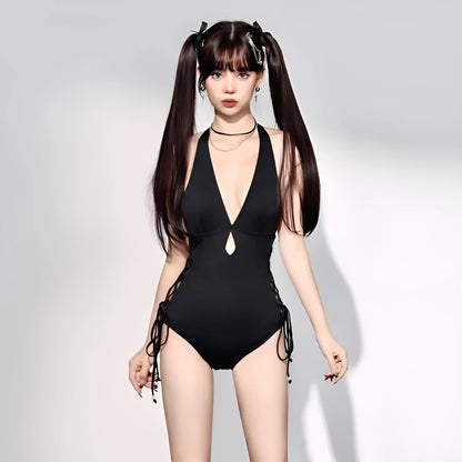 Black women's one-piece swimsuit with V-neck and hollow strap design.
