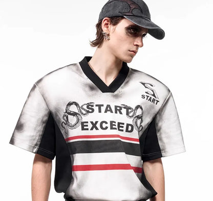 Women's short sleeve V-neck top with letter snake pattern print and padded shoulders.