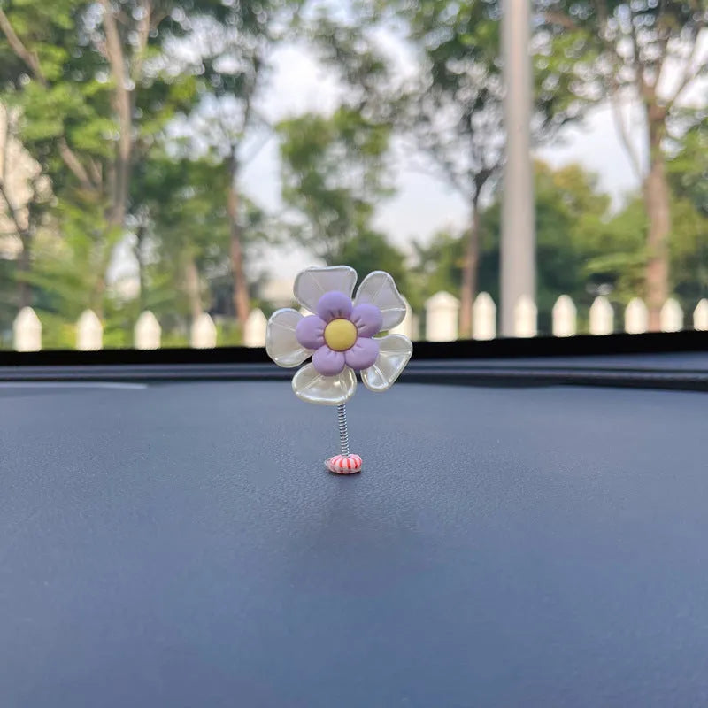 Small plastic car decoration swing measuring 5cm tall in blue, green, pink, purple, and yellow colour options