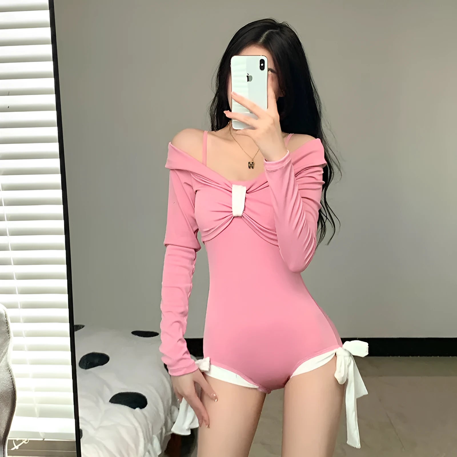 Women's long sleeve one-piece swimsuit in polyester fabric available in pink or black colours